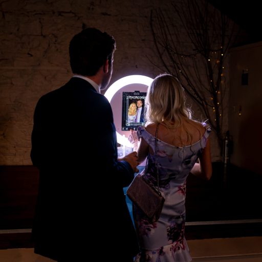 Wedding guests getting ready to use the Mobi Aura booth and have their photos taken